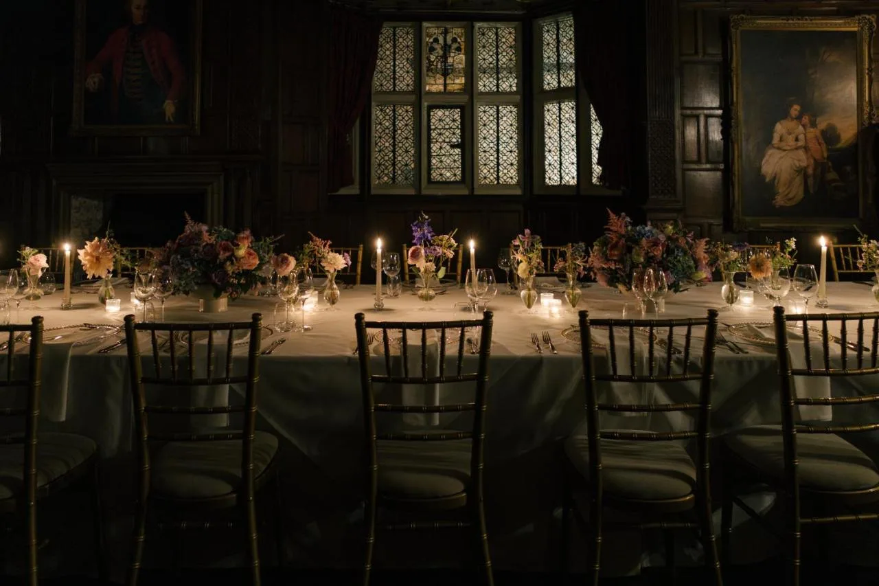 a long table with candles and chairs in a room at New Hall Hotel & Spa, Birmingham in Birmingham